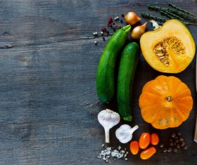 Vegetables and cut pumpkin on the desktop Stock Photo