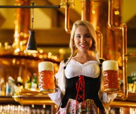 Waitress holding two glasses of beer Stock Photo 02