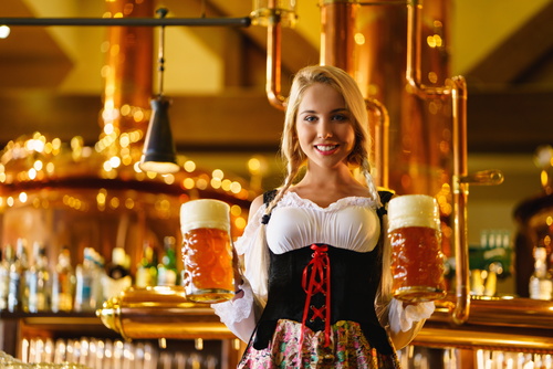 Waitress holding two glasses of beer Stock Photo 02