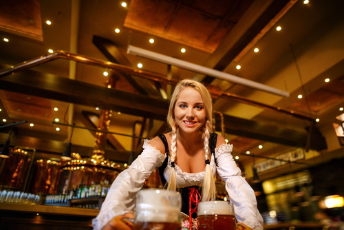 Waitress holding two glasses of beer Stock Photo 03