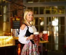 Waitress holding two glasses of beer Stock Photo 05