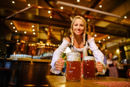 Waitress holding two glasses of beer Stock Photo 06