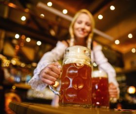 Waitress holding two glasses of beer Stock Photo 07