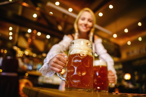 Waitress holding two glasses of beer Stock Photo 07