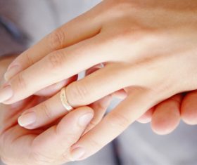Wearing wedding ring Stock Photo