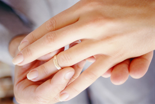 Wearing wedding ring Stock Photo