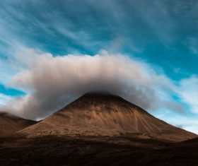 White cloud above mountain peak Stock Photo