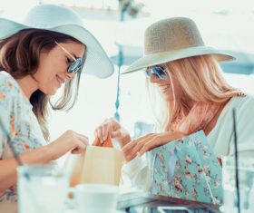 Woman chatting in cafe after shopping Stock Photo 01