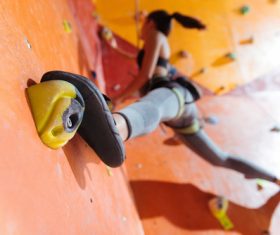 Woman indoor rock climbing Stock Photo 02