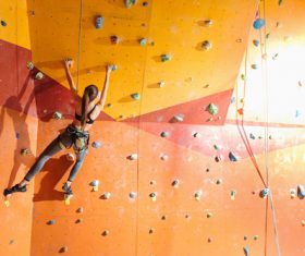 Woman indoor rock climbing Stock Photo 03