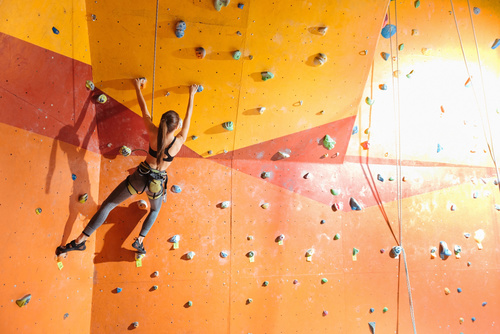 Woman indoor rock climbing Stock Photo 03