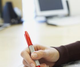 Woman reading a newspaper looking for a job Stock Photo