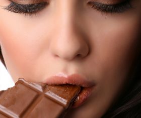 Woman tasting chocolate Stock Photo 03