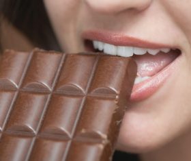 Woman tasting chocolate Stock Photo 04