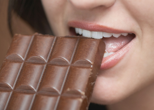 Woman tasting chocolate Stock Photo 04