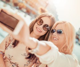 Woman using cell phone selfie Stock Photo