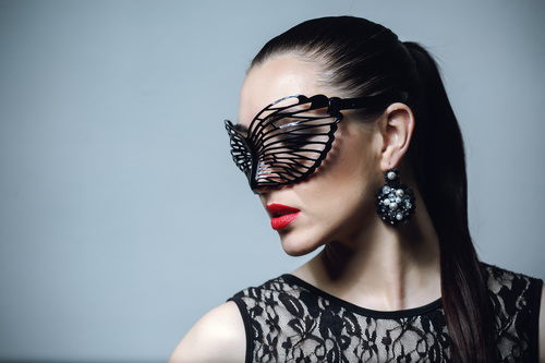 Woman wearing black butterfly mask Stock Photo 07