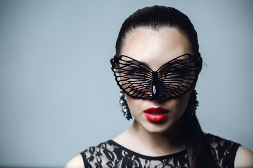 Woman wearing black butterfly mask Stock Photo 08