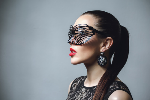 Woman wearing black butterfly mask Stock Photo 10