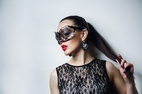 Woman wearing black butterfly mask Stock Photo 11