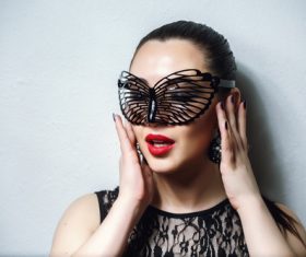 Woman wearing black butterfly mask Stock Photo 14
