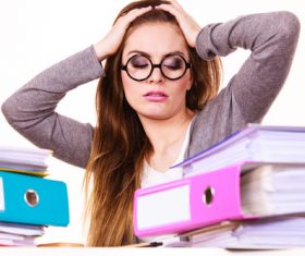 Woman who is overworked Stock Photo