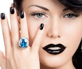Woman with fashion make up and hairstyle wears blue gemstone ring Stock Photo 06