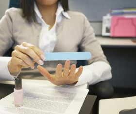 Woman with manicure in the office Stock Photo