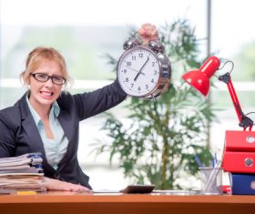 Woman working overtime Stock Photo