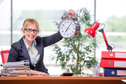 Woman working overtime Stock Photo