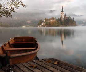 Wooden boat and beautiful frosty calm lake scene Stock Photo