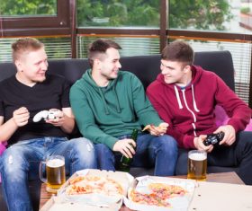 Young friends at party playing games Stock Photo