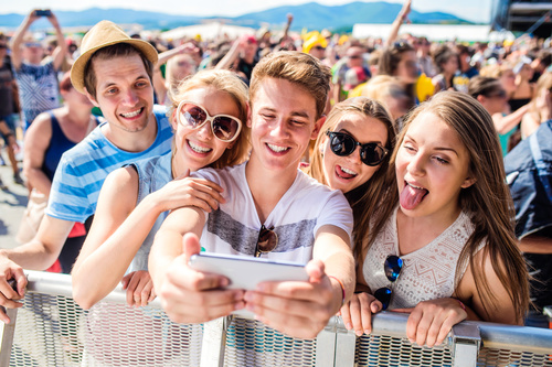 Young friends who use smartphones selfie Stock Photo