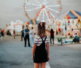 Young girl in amusement park Stock Photo