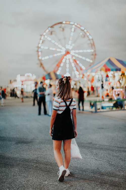 Young girl in amusement park Stock Photo