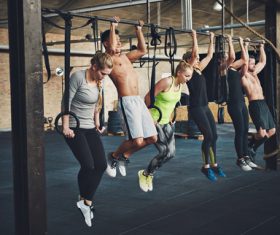 Young man doing pull-ups Stock Photo