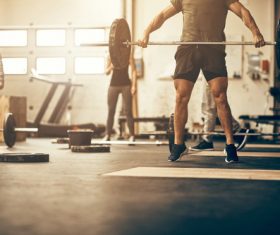 Young man weightlifting fitness Stock Photo