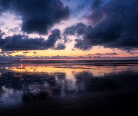 cloudscape above calm lake Stock Photo