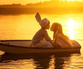 little boy boating on the lake with little girl Stock Photo 05