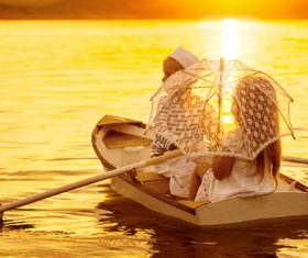 little boy boating on the lake with little girl Stock Photo 07