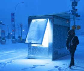 person walking under cold snowy weather Stock Photo