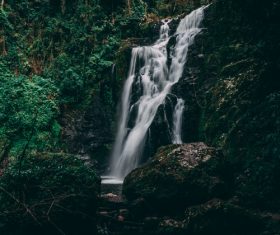 quiet and secluded forest waterfall Stock Photo
