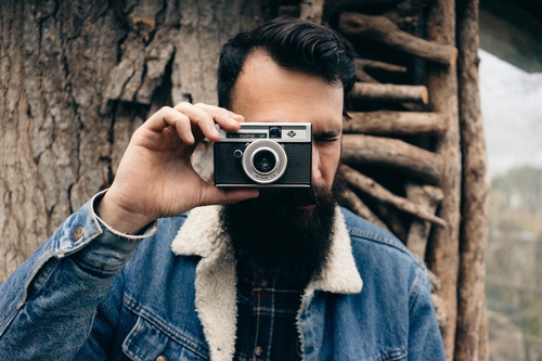 Bearded man with hands shoot camera Stock Photo