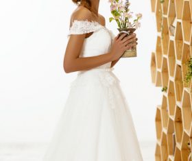 Blonde pretty woman holding flower arrangement Stock Photo 03