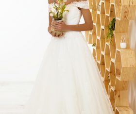 Blonde pretty woman holding flower arrangement Stock Photo 05