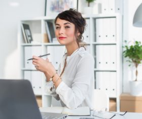 Business woman drinking coffee in the office Stock Photo