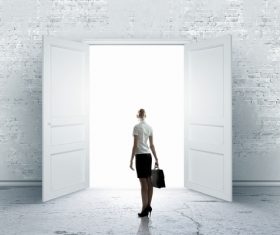 Business woman with open door Stock Photo