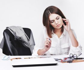 Businesswoman looking at documents on the desk Stock Photo 01