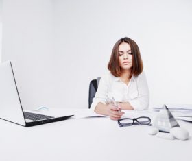 Businesswoman looking at documents on the desk Stock Photo 03