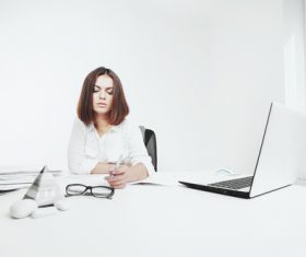 Businesswoman looking at documents on the desk Stock Photo 04